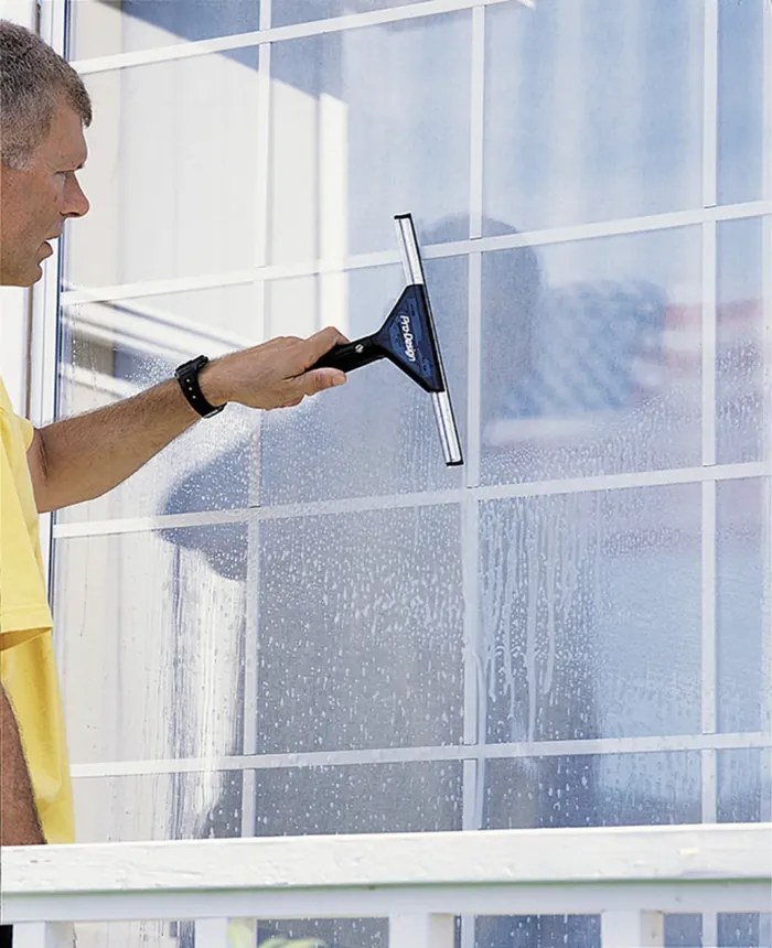 Exterior window being cleaned with a squeegee
